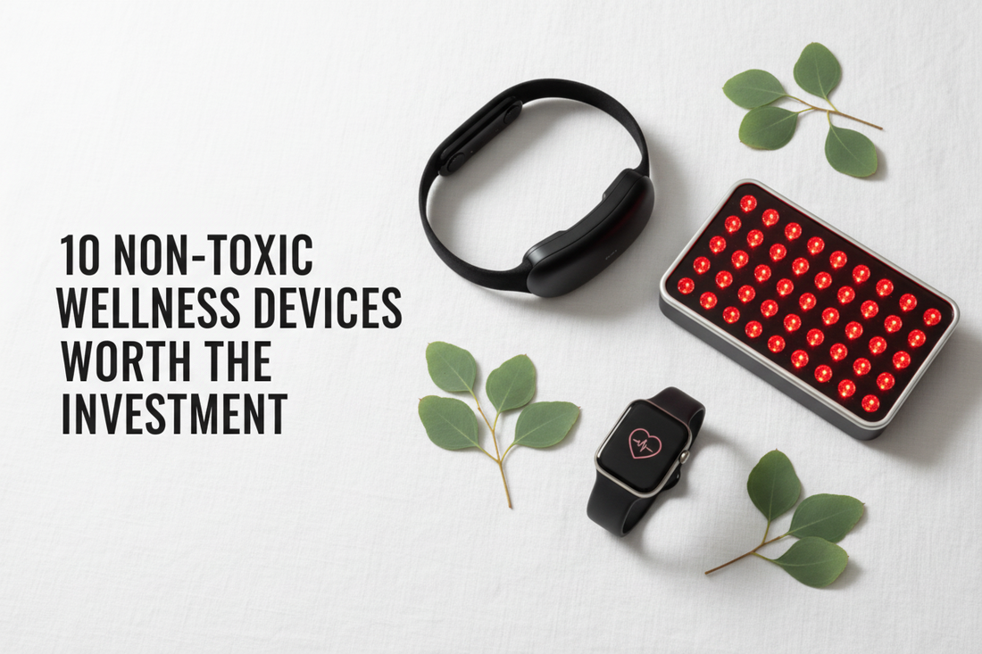 Clean flat lay of non-toxic wellness devices including a meditation headband, red light therapy panel, and smartwatch on white linen with eucalyptus — 10 Non-Toxic Wellness Devices Worth the Investment — BodyWell1