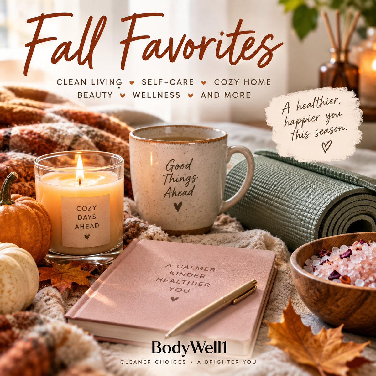 Cozy fall self-care scene with a candle, journal, yoga mat, bath salts, warm drink, pumpkins, and autumn leaves featuring BodyWell1 Fall Favorites.