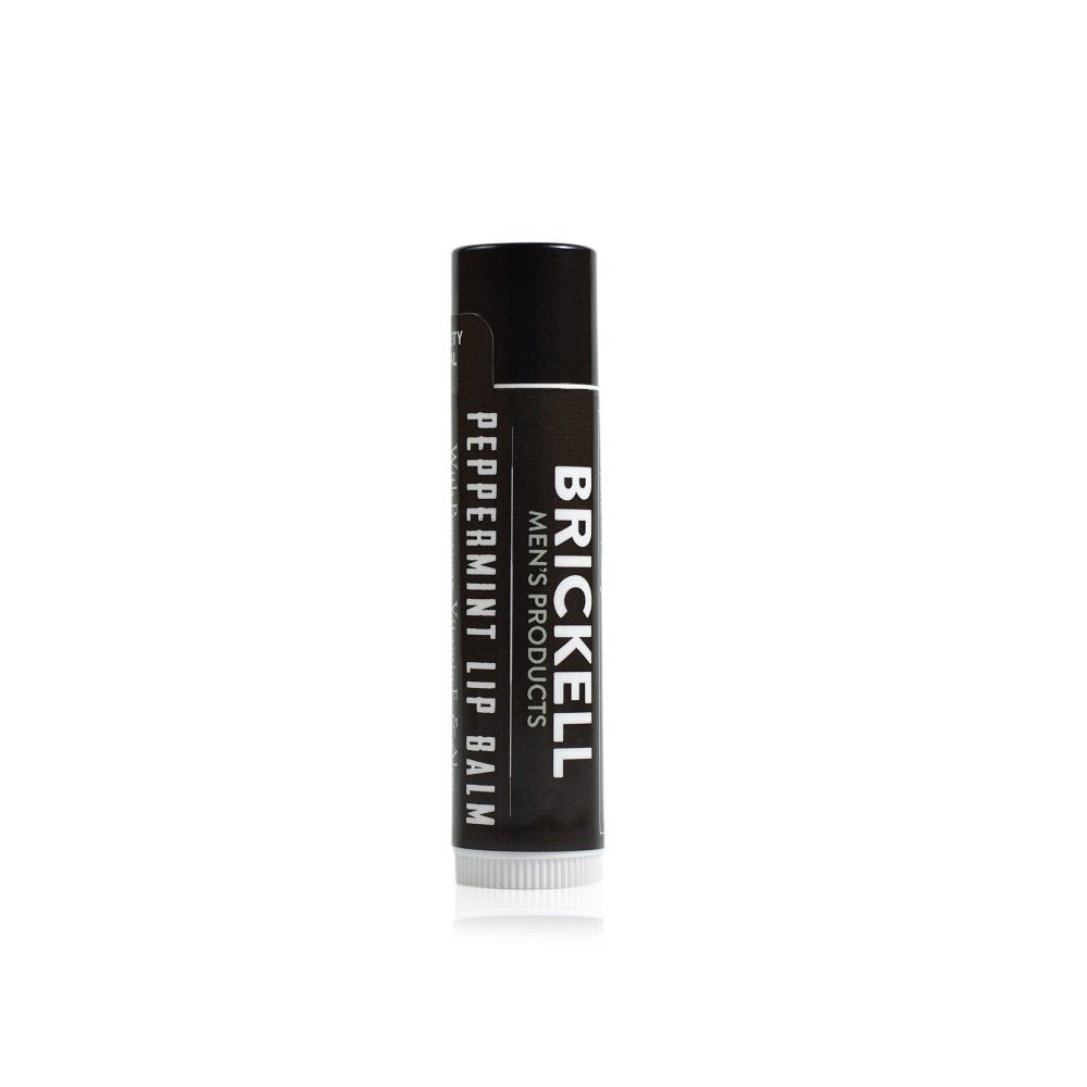 Black lip balm tube with 'Brickell' branding on a white background