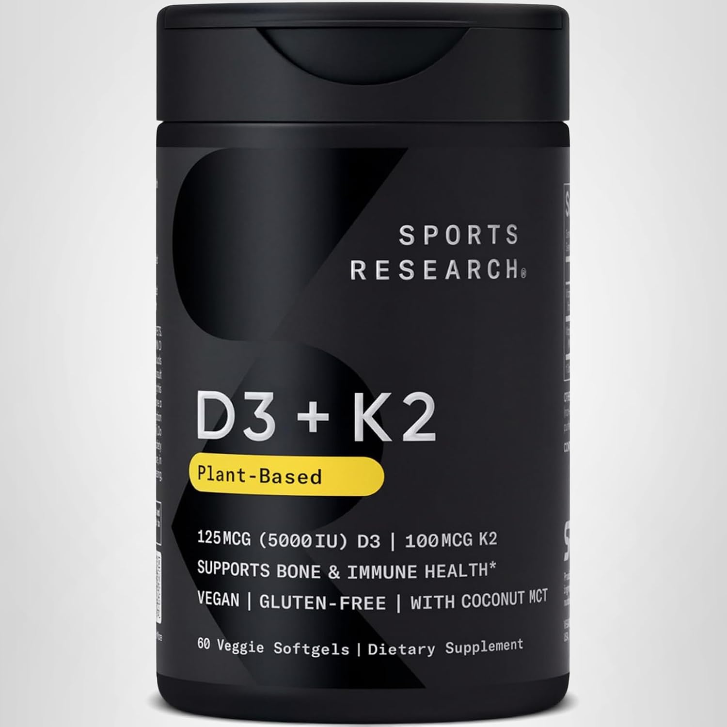 Black supplement bottle labeled 'D3 + K2' by Sports Research on a light gray background