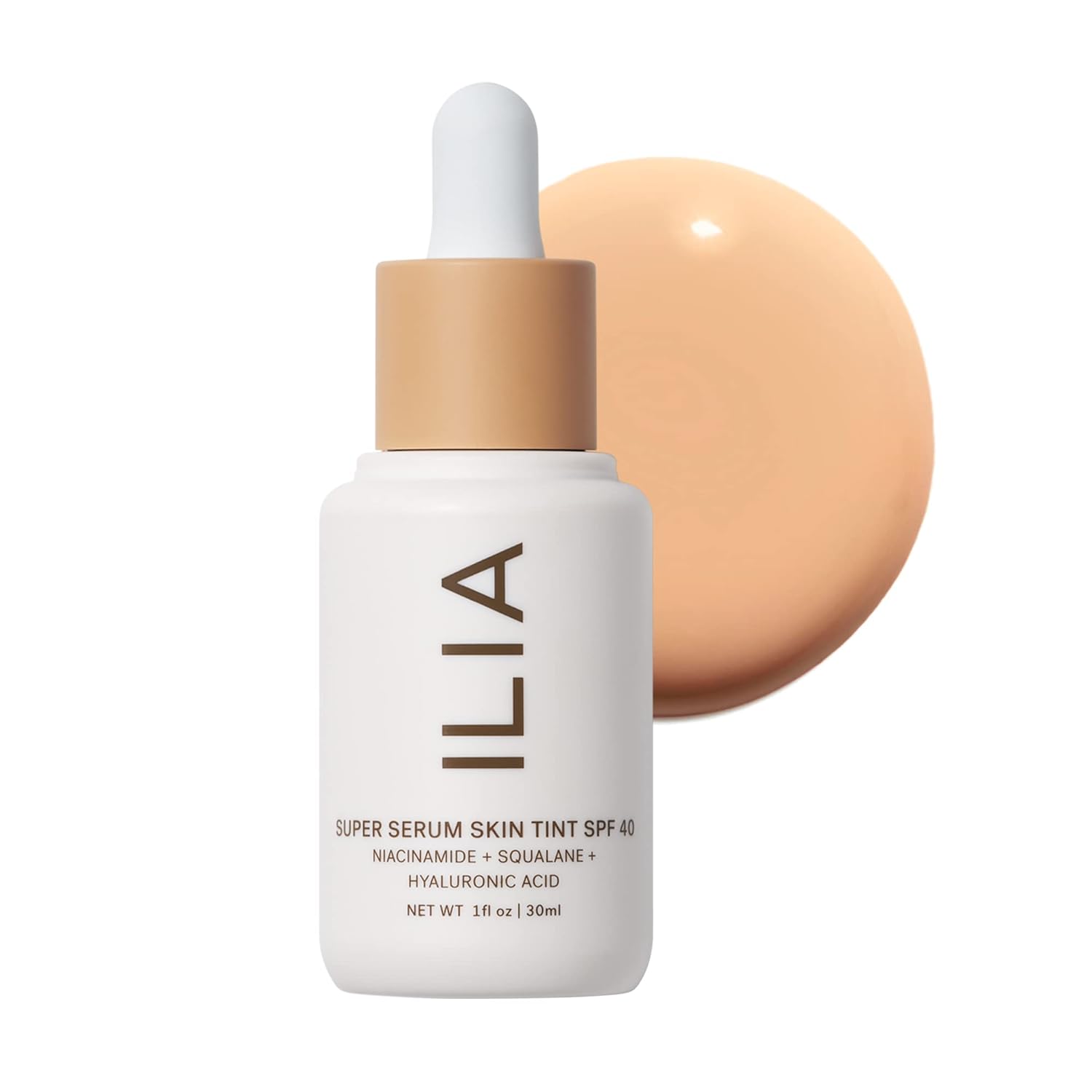 ILIA Super Serum Skin Tint bottle with applicator on a white background