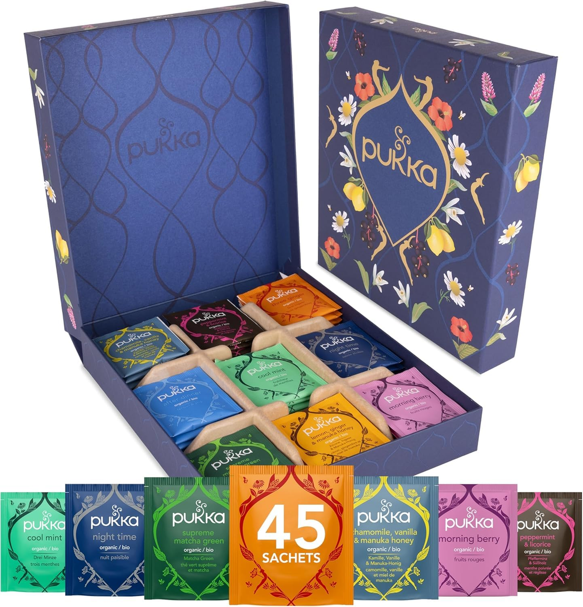 Pukka floral tea gift box displayed open with colorful individually wrapped sachets and a 45-sachet label.