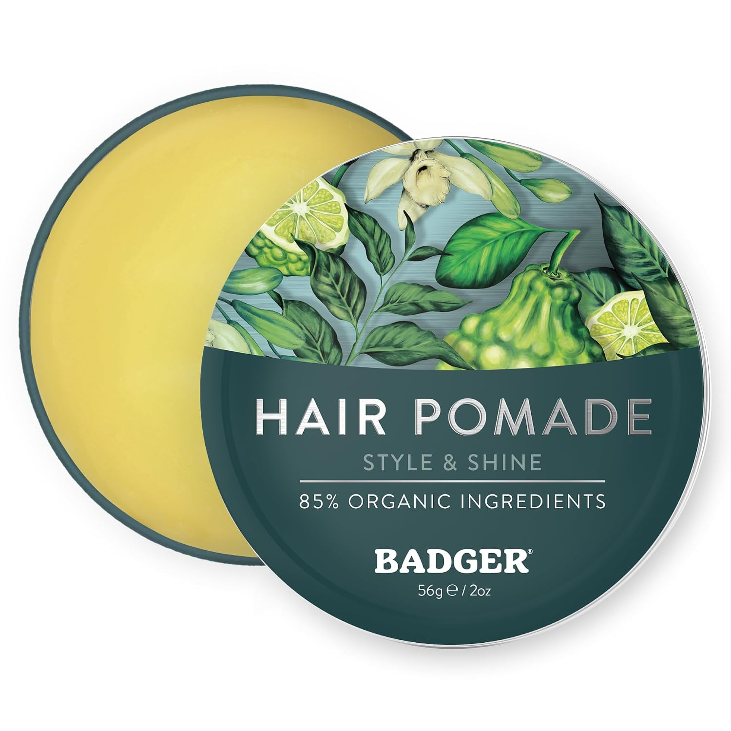 Badger Hair Pomade for Men open tin showing golden organic pomade with botanical illustrated lid — 85% organic ingredients medium hold and shine