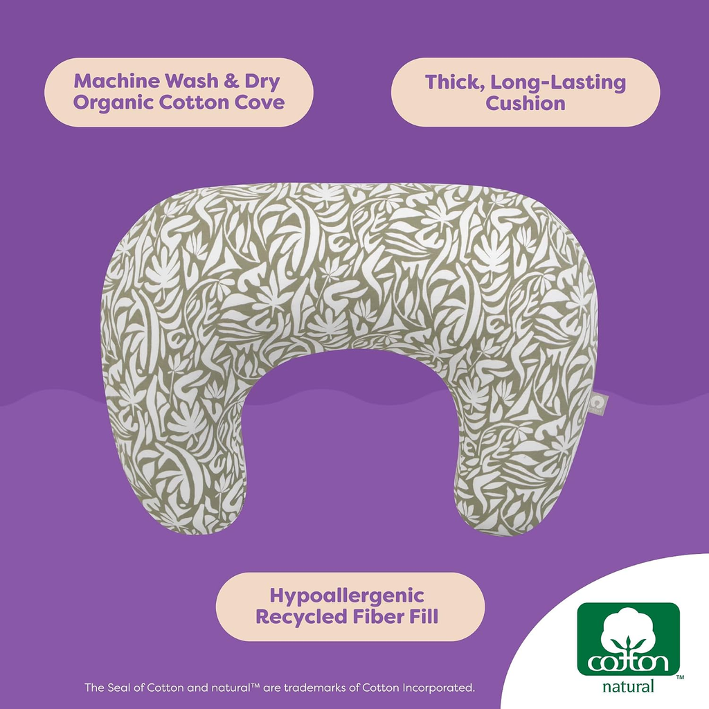 Boppy Nursing Pillow with organic cotton green cut out leaves cover on white background — machine washable, hypoallergenic recycled fiber fill