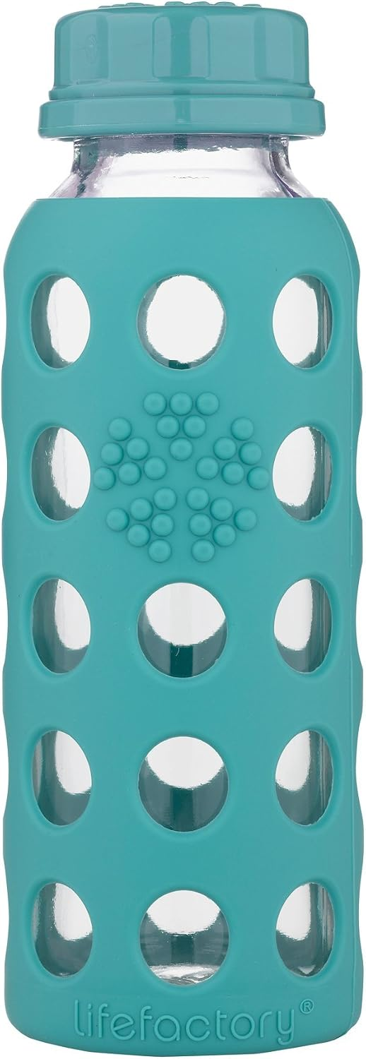 Lifefactory 9oz glass baby bottle with flat cap and kale teal silicone sleeve on white background