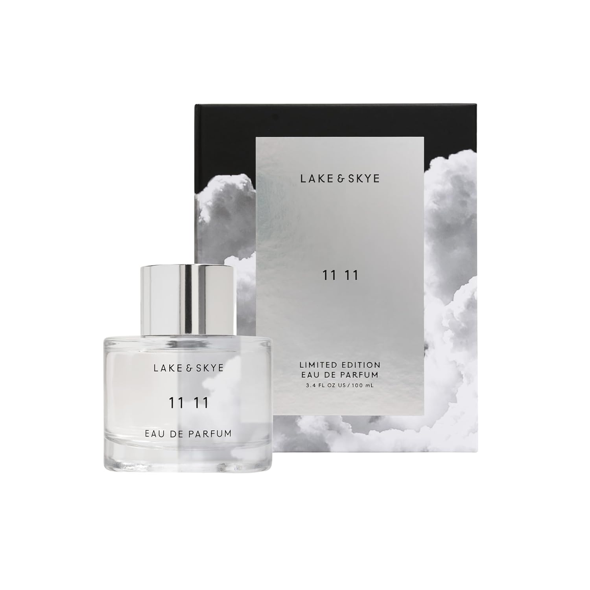 Lake & Skye 11 11 Eau de Parfum Limited Edition — clear glass bottle with silver cap beside dramatic black and silver cloud-print box, clean skin musk amber fragrance, 3.4 fl oz 100mL