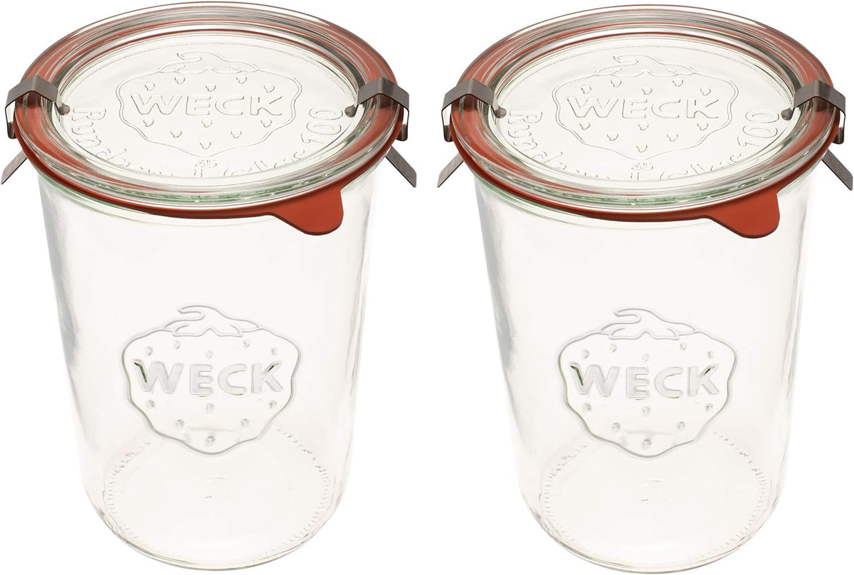 Weck 743 mold jar 2-pack 3/4 liter wide mouth glass canning jars with airtight lids rubber gaskets and stainless steel clips on white background