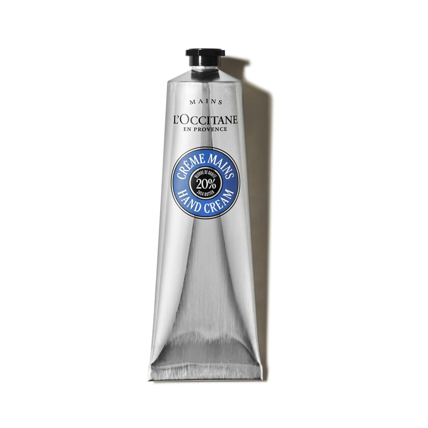 L'Occitane 20% Organic Shea Butter Hand Cream in iconic silver tube with blue Crème Mains label on a clean white background.
