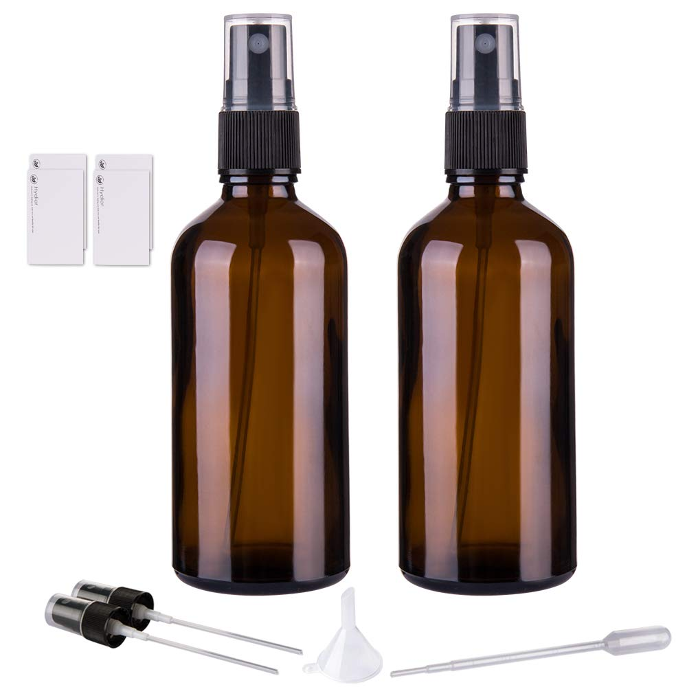 Two amber glass spray bottles 4oz with black fine mist sprayer tops funnel and pipette accessories on white background