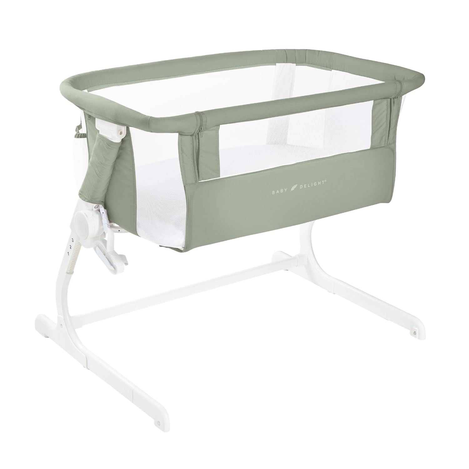 Baby Delight Beside Me Dreamer Bassinet in Organic Sage with white metal frame, sage green GOTS certified organic cotton fabric, mesh walls for airflow, and 6-position height adjustment for bedside sleeping
