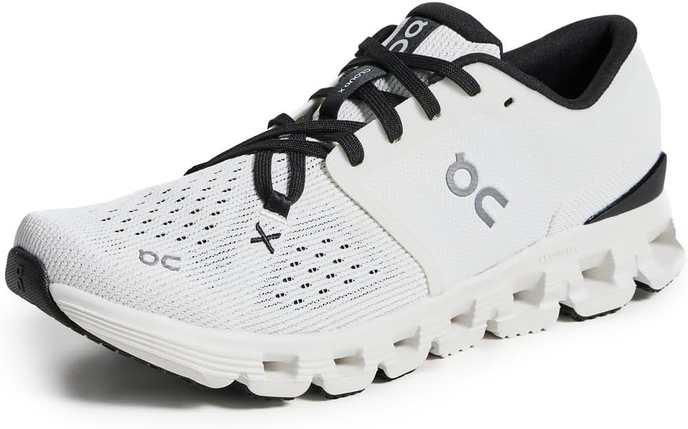 On Women's Cloud X 4 Sneakers in Ivory and Black — lightweight training shoe with CloudTec sole and perforated mesh upper on white background