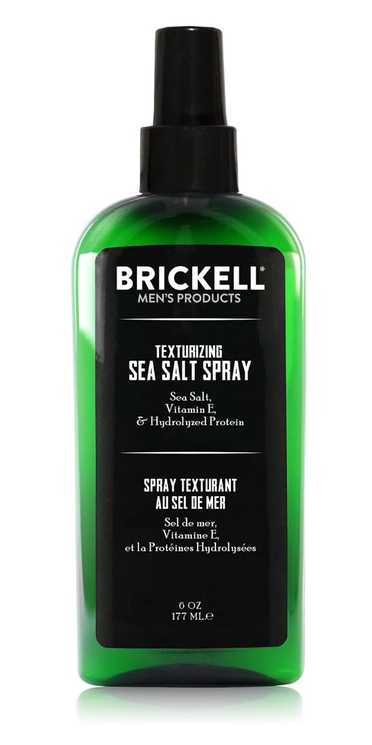 Brickell Men's Texturizing Sea Salt Spray dark green bottle with black pump top on white background