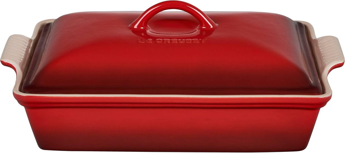 Le Creuset Stoneware Covered Rectangular Casserole 12x9 in Cerise red — non-toxic nonporous enamel glaze with tight-fitting lid on white background