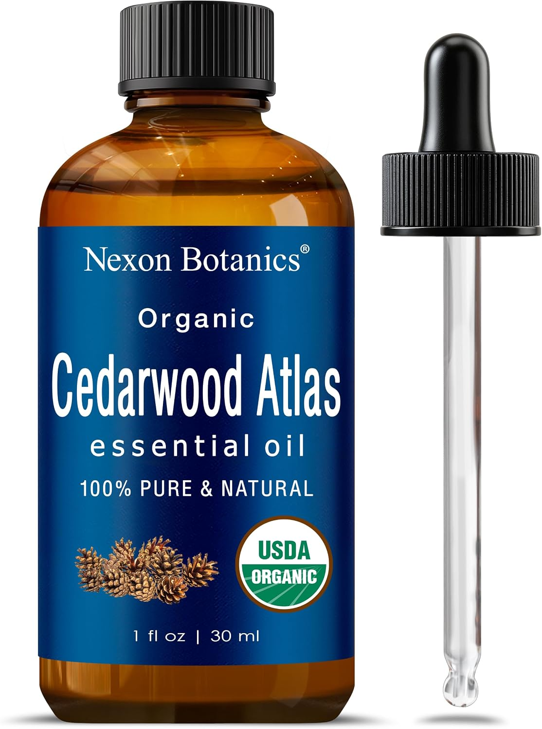 Nexon Botanics Organic Cedarwood Atlas Essential Oil 30 mL amber glass bottle with dark dropper cap, deep blue label showing USDA Organic seal, 100% Pure and Natural, Hexane Free