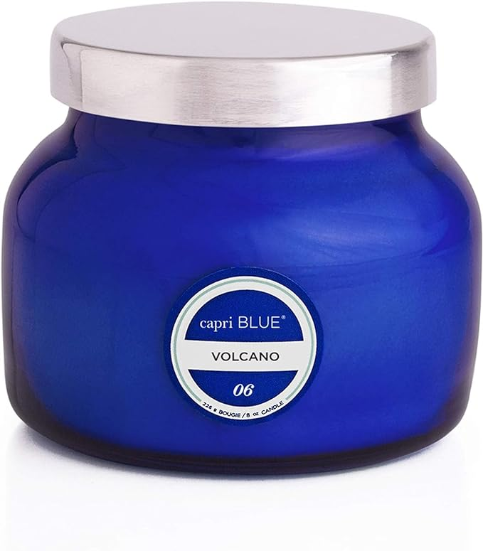 Capri Blue Volcano scented candle in iconic cobalt blue glass jar with silver lid on white background