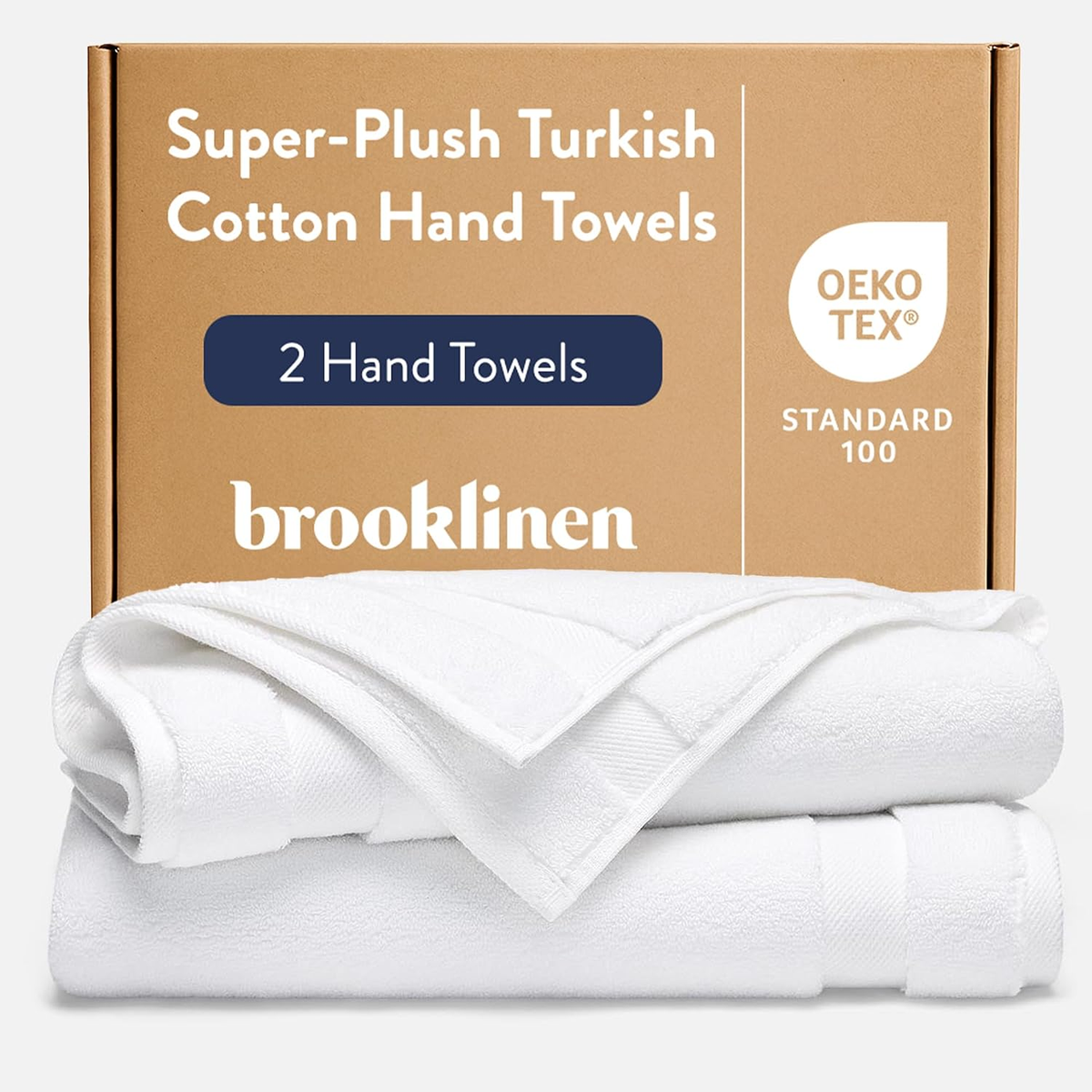 Brooklinen Super-Plush Turkish Cotton Hand Towels — two white folded towels beside kraft gift box with OEKO-TEX Standard 100 certification badge, set of 2, 820 GSM