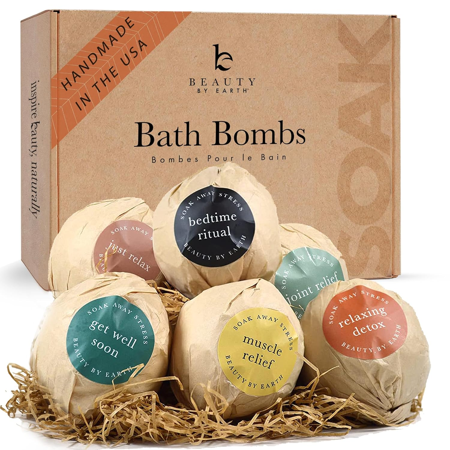 Beauty by Earth Bath Bombs Gift Set 6-pack in kraft paper wrapping with individual wellness labels including Bedtime Ritual, Muscle Relief, Joint Relief, Relaxing Detox, Get Well Soon, and Just Relax, displayed in front of the branded kraft gift box.
