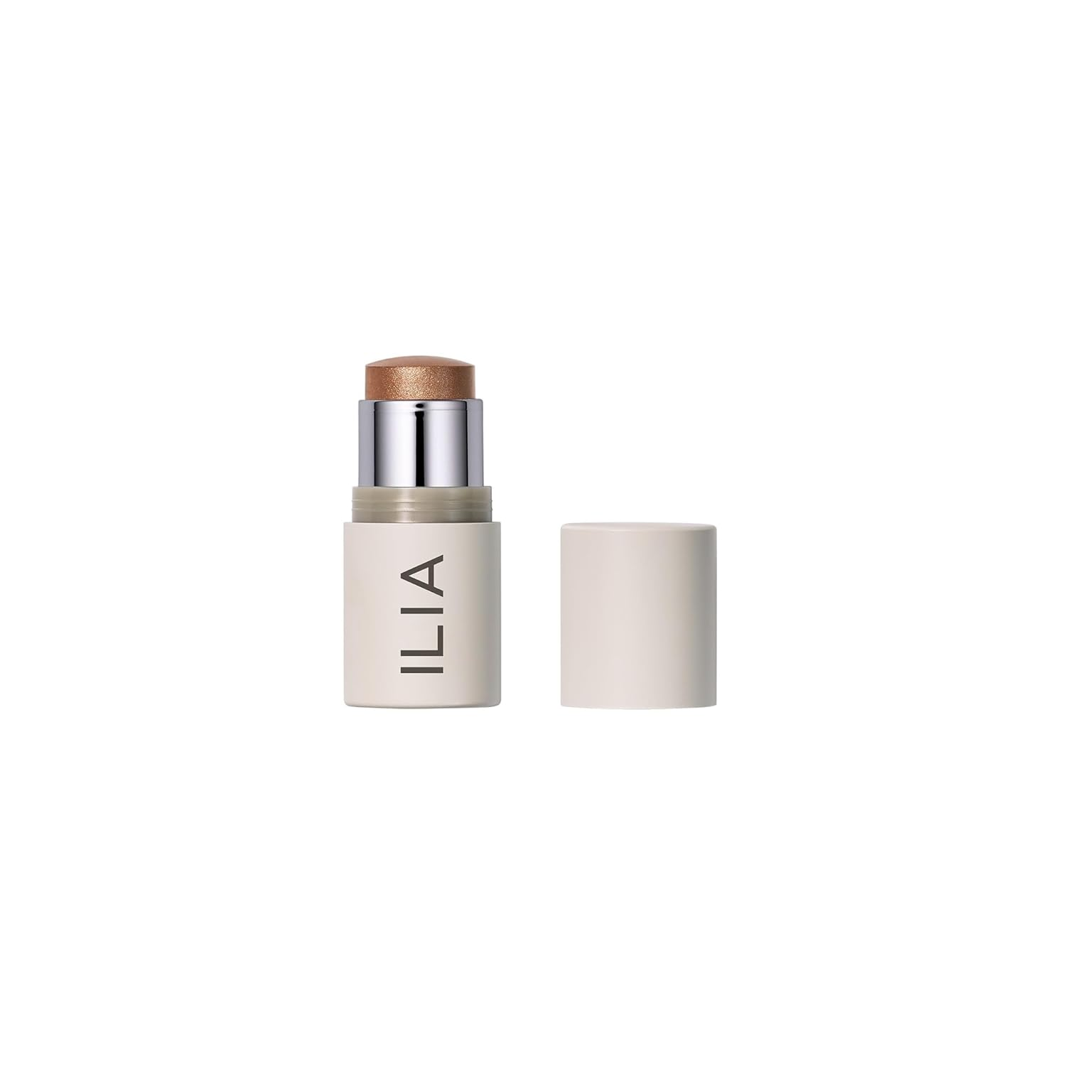 ILIA Multi-Stick in In The City Bronze Pearl open cream highlighter stick on white background showing warm bronze pearl shimmer