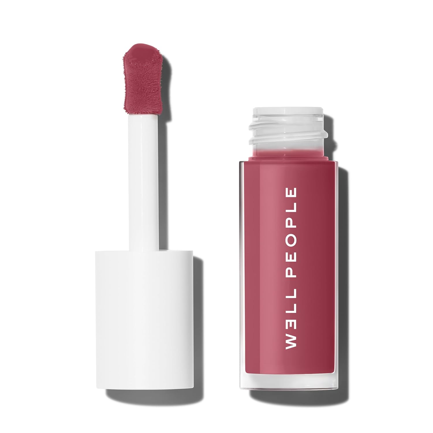 Lip gloss with applicator on a white background, featuring the brand 'Well People'.
